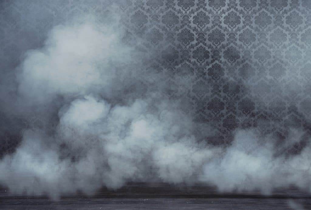 Wallpapered wall obscured by smoke