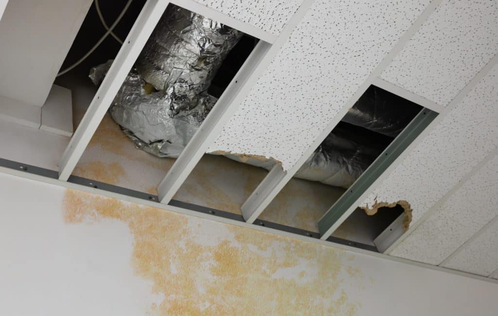 A ceiling damaged by a burst pipe causing major water damage.